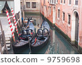 Two gondola in Venice near pier 9759698