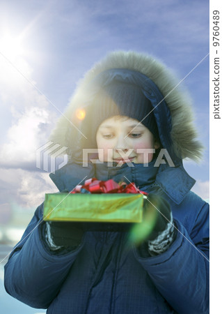 happy boy with gift outdoors 9760489