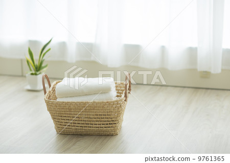Laundry basket placed in the living room 9761365