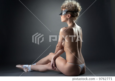 Slender naked ballerina posing in carnival mask Slender naked ballerina posing in carnival mask 9762771