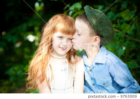 Little boy and girl on nature in the summer 9763009