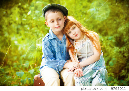 Little boy and girl on nature in the summer Little boy and girl on nature in the summer 9763011