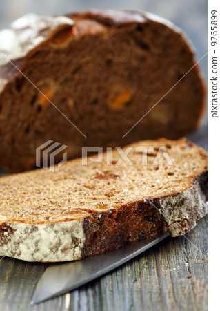 Rye bread with dried apricots close-up. Rye bread with dried apricots close-up. 9765899