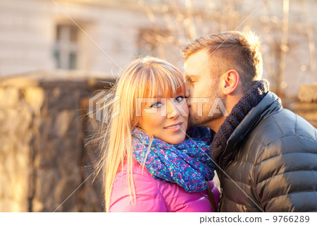 Young man kissing a beautiful woman Young man kissing a beautiful woman 9766289