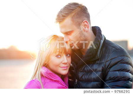 Young man embraces his girlfriend 9766291