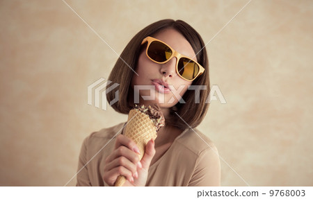 Ice cream woman singing in cone like in microphone Ice cream woman singing in cone like in microphone 9768003