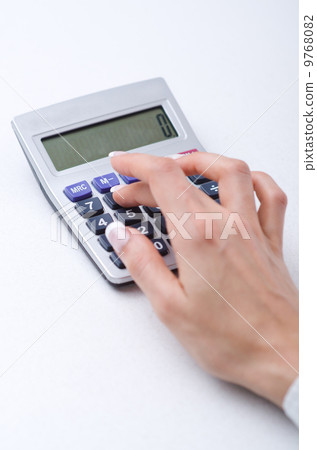 Hands working on the calculator 9768082