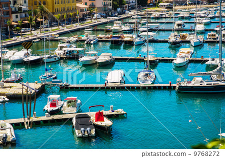 Port with many yachts on summer day 9768272