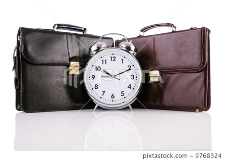 Alarm clock and briefcase isolated on white Alarm clock and briefcase isolated on white 9768324