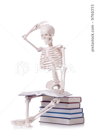 Skeleton reading books on white 9768355