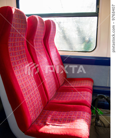 Row of red seats in the train Row of red seats in the train 9768407