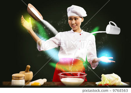Asian female chef in the kitchen conjures Asian female chef in the kitchen conjures 9768563