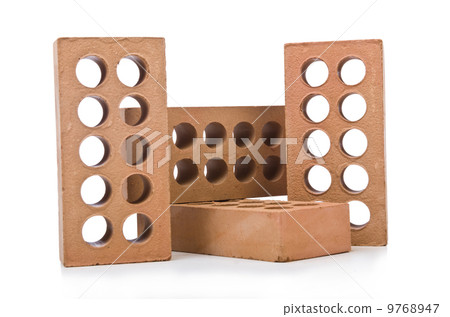 Stack of clay bricks isolated on white Stack of clay bricks isolated on white 9768947