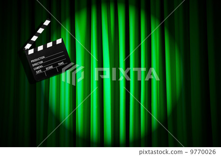 Movie clapper board against curtain 9770026