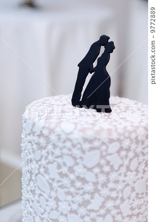 Closeup of wedding cake topper figurines 9772889