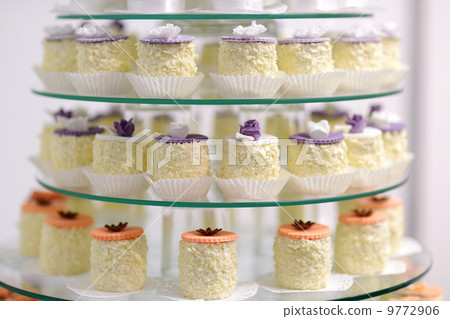 Decorated cupcakes on a glass plate Decorated cupcakes on a glass plate 9772906