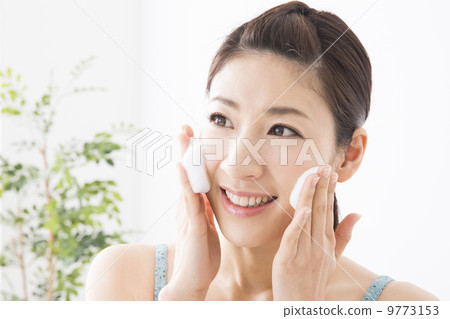 A woman washing her face A woman washing her face 9773153