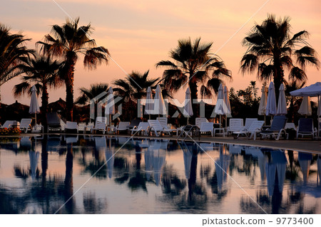 Beautiful swimming pool at sunset Beautiful swimming pool at sunset 9773400