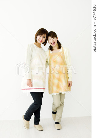 A woman in an apron A woman in an apron 9774636