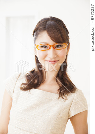 A woman wearing glasses A woman wearing glasses 9775227