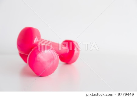 Two pink glossy dumbbell isolated on white 9779449