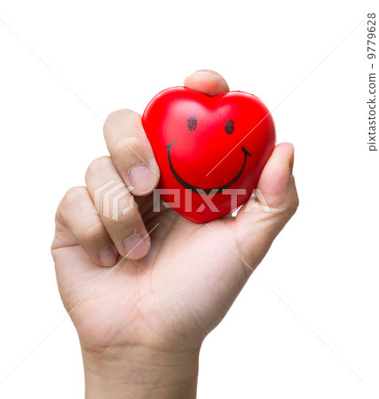 Hand squeezing a stress ball 9779628