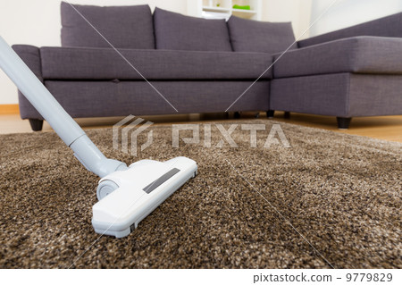Carpet with vacuum cleaner in living room 9779829