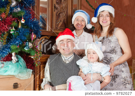 happy family of three generations in christmas hats happy family of three generations in christmas hats 9782027