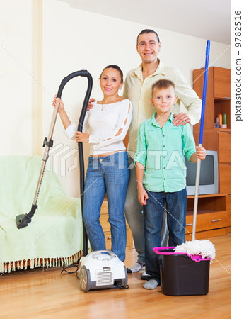 Happy family dusting in home Happy family dusting in home 9782516