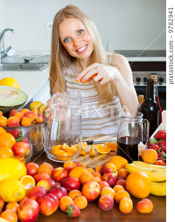 Happy girl making beverages Happy girl making beverages 9782941