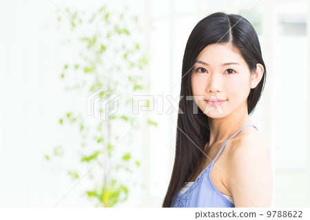 A woman relaxing at the window 9788622