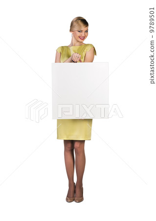 Beautiful young business woman with blank board 9789501