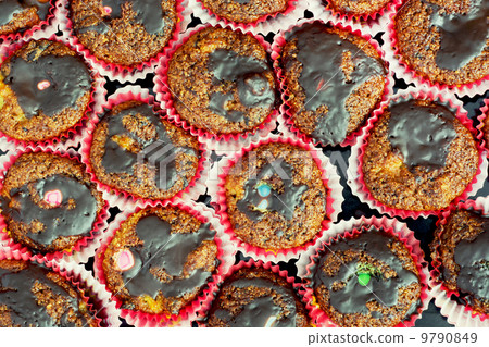 Muffins with chocolate on a tray Muffins with chocolate on a tray 9790849