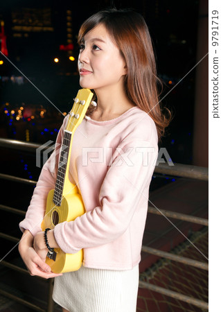 Pretty Asian woman with ukelele Pretty Asian woman with ukelele 9791719