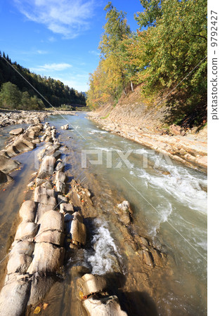 Autumn mountain stony river 9792427