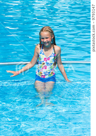 Girl in summer outdoor pool. Girl in summer outdoor pool. 9793147
