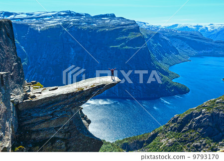 Trolltunga summer view (Norway) and man on rocks edge. 9793170