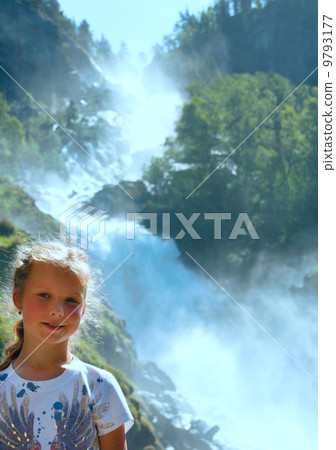 Portrait girl on summer waterfall background 9793177