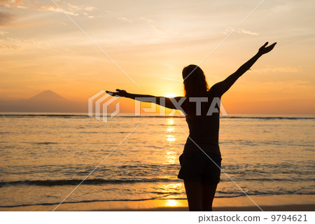 Woman watching sunset Woman watching sunset 9794621