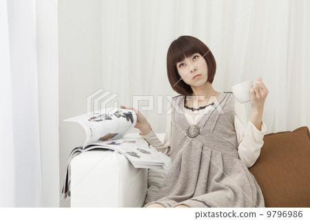 Women watching a magazine Women watching a magazine 9796986