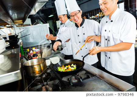 Asian Chefs in restaurant kitchen cooking Asian Chefs in restaurant kitchen cooking 9798346