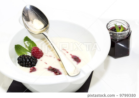 semolina porridge with berries decorated with berry jam 9799380