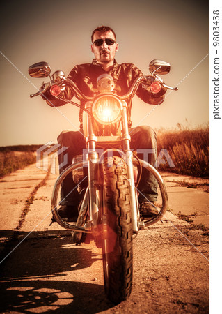Biker on a motorcycle Biker on a motorcycle 9803438