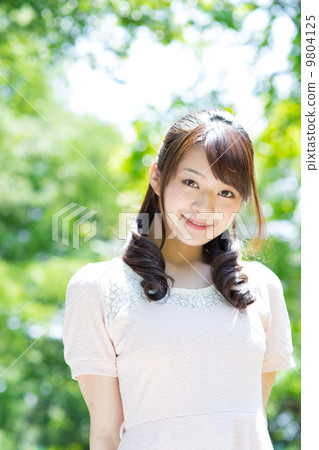 A woman in green 9804125