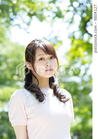 A woman in green A woman in green 9804127