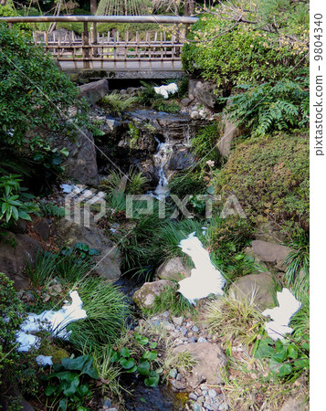 Japanese garden snow melting stream Japanese garden snow melting stream 9804340
