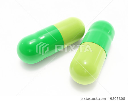 Two green pills on white 9805808