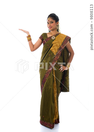 traditional indian female giving greetings during diwali 9808113