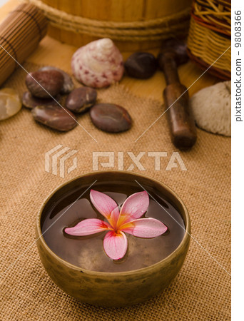 frangipani spa concept photo, lowlight ambient spa lighting, sha 9808366