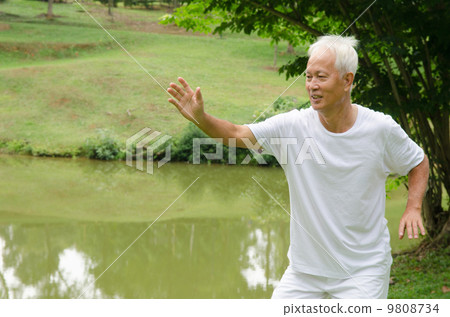 asian senior male workout in the park 9808734